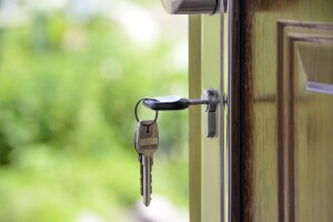 Keys opening front door to a home purchased with Jumbo Loans